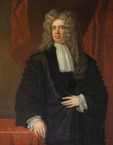 Portrait of Sir James Stewart of Goodtrees. A serious looking chap in a large, curly grey wig. He wears black judicial robes and sports a fetching lace cravat. He stares directly at the viewer and looks both serious and self-confident.